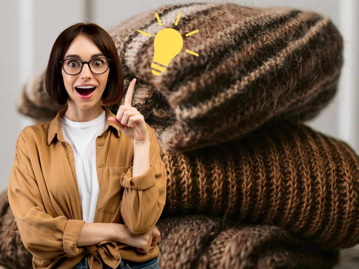 donna con un'idea e maglioni di lana